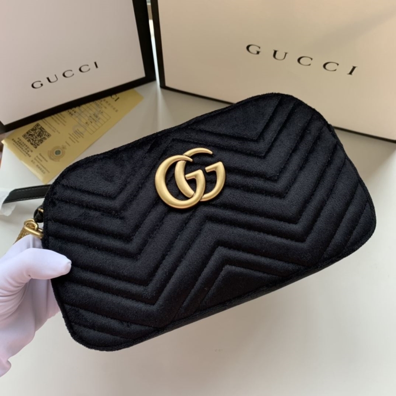 G*u*i clutch bags